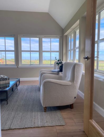Picture of two seats in sun lounge with view over the sea