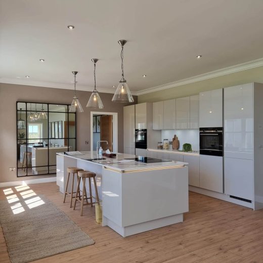 Picture of a kitchen with island / breakfast bar, modern appliances and features